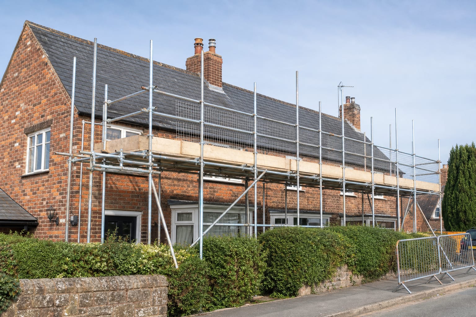 Professional scaffolding prepared around a British home for solar installation